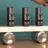 Out of sync metronomes slowly synchronise spontaneously