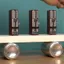 Out of sync metronomes slowly synchronise spontaneously