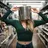 woman with casserole on head standing on the aisle