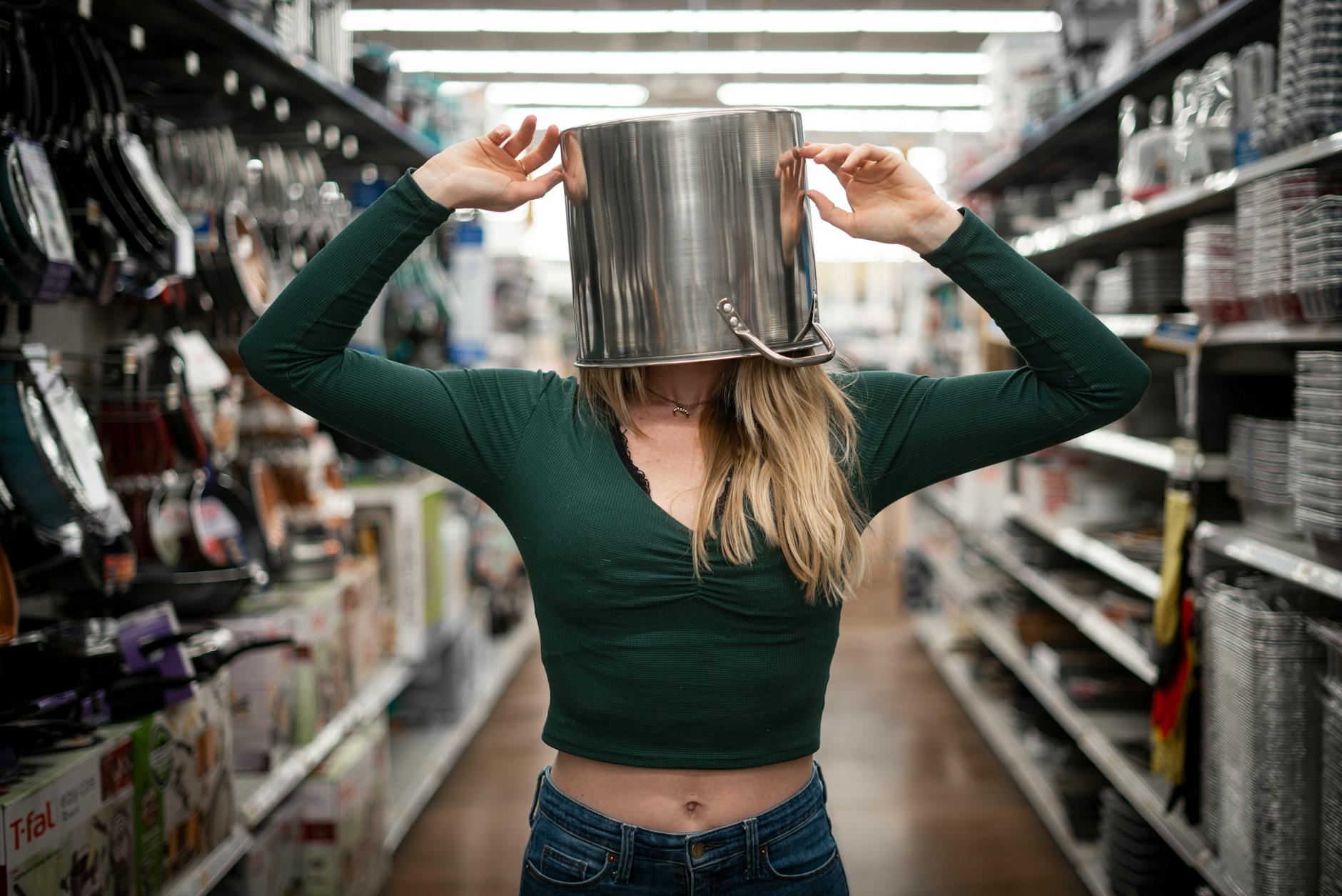 woman with casserole on head standing on the aisle